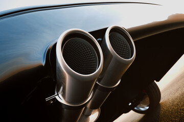 Sleek Dual Exhaust Pipes on a High-Performance Sports Car's Rear