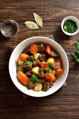 Beef meat stewed with potatoes, carrots and spices