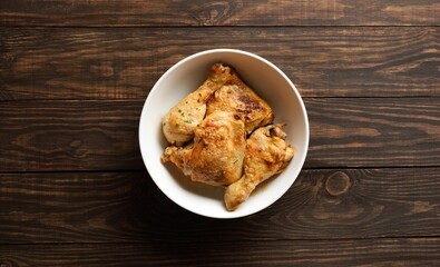 Stewed chicken with herbs in bowl