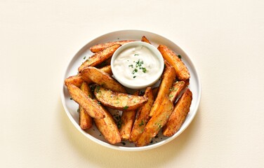 Oven baked potato wedges with sauce