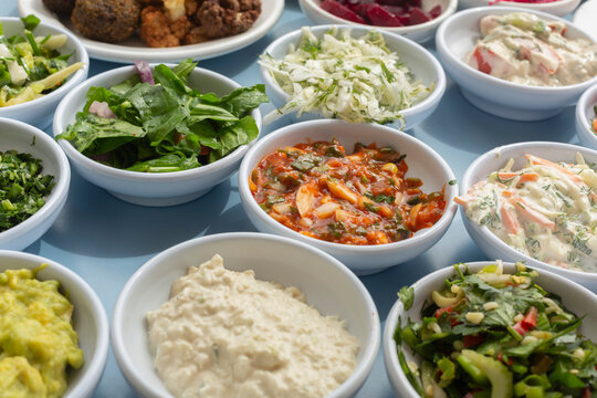 Close up still life of Israeli meze appetizers in bowls
