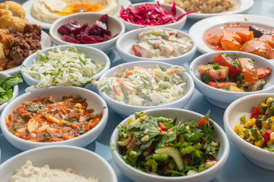 Still life close up variety of Israeli meze appetizers in bowls
