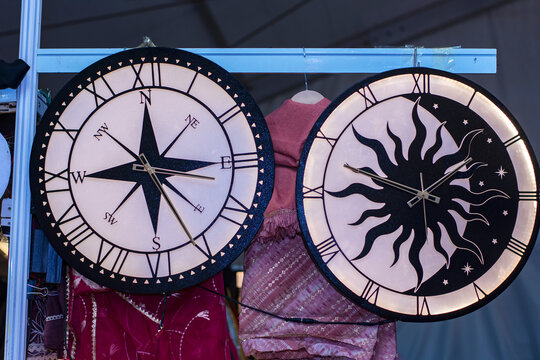22nd December, 2022, Kolkata, West Bengal, India: Old analog compus hanging whit big antique clock for sale at International trade fair, Kolkata.
