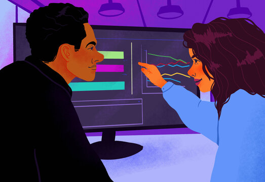 Business people discussing data on computer screen in office meeting
