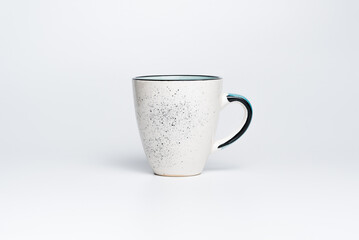 Empty cup isolated on white studio background.