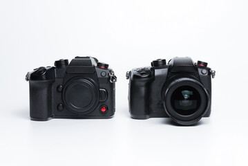 Two photo cameras on a white background.