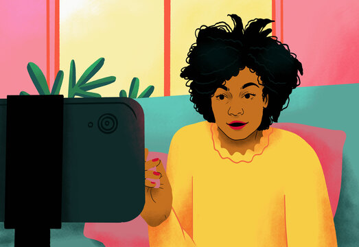 Female influencer talking behind smart phone
