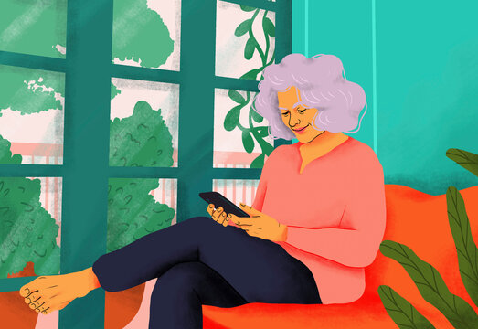 Happy, serene senior woman using smart phone on sofa at home
