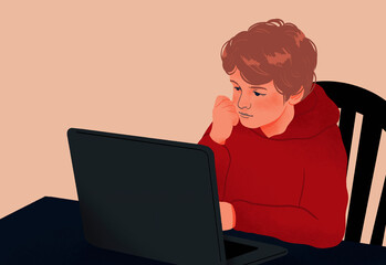 Boy doing homework, using laptop at dining table

