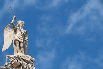 Statue of St Michael killing the Satan , on the top of St Jacobs cathedral in Sibenik, Croatia
