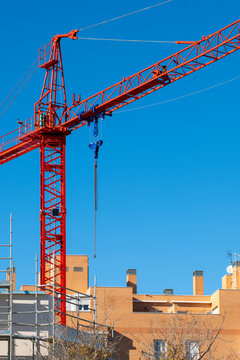 Construction crane in a district of new apartment buildings in Madrid