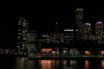 Fototapeta na wymiar the city skyline at night, showing illuminated lights and reflections