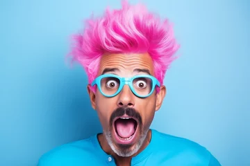 Foto op Plexiglas Pink hair. Young shocked guy wearing casual clothes and glasses celebrating shocked of surprised open eyes wide. What just happened. Portrait of a shocked young man wears glasses on colour background. © Nataliia_Trushchenko