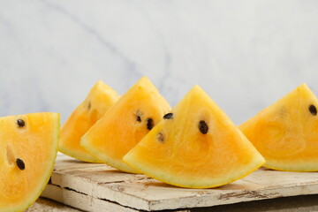 fresh and sweet, Cut yellow watermelon on white table