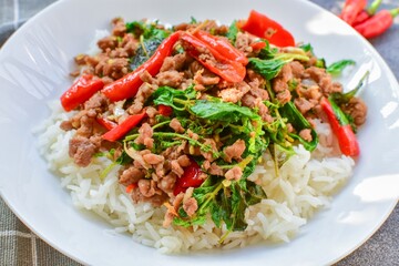 Rice topped with stir fried Thai basil with minced pork , pad ka praow moo sap,Thai food, top view food table