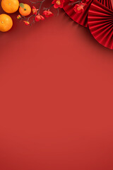 Chinese lunar new year background with fresh tangerine and red envelope.