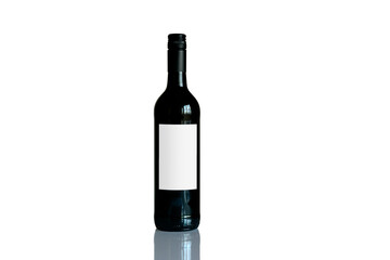 Bottle of red wine with blank white label and reflection