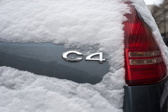 Mulhouse - France - 10 january 2024 - Closeup of Citroen C4 logo on front car parked in the street covered by the snow