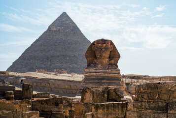 Fototapeta na wymiar Sphinx statue and Cheops pyramid in Giza Egypt