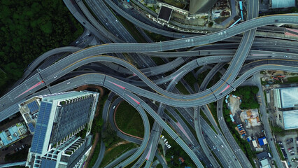 Aerial view of the expressway in Malaysia in the city of Kuala Lumpur, Penchala link. A birds eye view of a confusing traffic intersection. Architecture and urban planning of the capital.