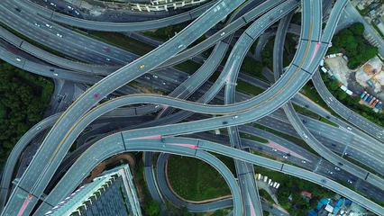 Foto op Plexiglas Aerial view of the expressway in Malaysia in the city of Kuala Lumpur, Penchala link. A birds eye view of a confusing traffic intersection. Architecture and urban planning of the capital. © moonmovie
