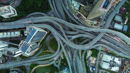 Fototapeta premium Aerial view of the expressway in Malaysia in the city of Kuala Lumpur, Penchala link. A birds eye view of a confusing traffic intersection. Architecture and urban planning of the capital.