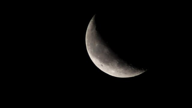 crescent phase of the moon, Lunar surface with craters, Hyderabad, India