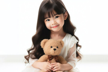 A cute girl playing with a teddy bear with copy space for text on solid white background. ai generative