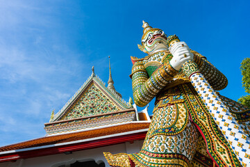 Fototapeta na wymiar Gates to Ordination Hall with statues of Giants, demon guardians at Wat Arun