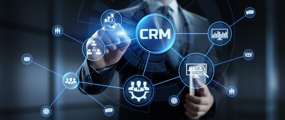 CRM Customer relationship management concept. Businessman pressing button on screen.