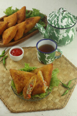 Indonesian snacks, risoles triangles coated with breadcrumbs filled with vegetables and served warm