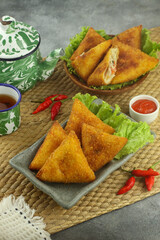 Indonesian snacks, risoles triangles coated with breadcrumbs filled with vegetables and served warm