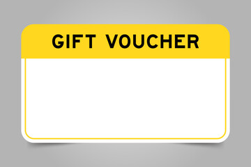 Label banner that have yellow headline with word gift voucher and white copy space, on gray background