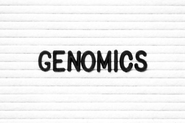 Black color letter in word genomics on white felt board background