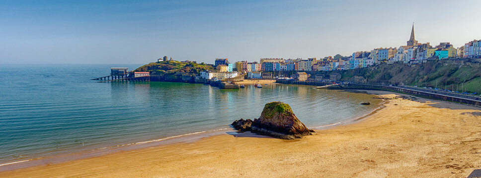 Tenby coast and harbour with lifeboats and sailing boats in Pembrokeshire South Wales