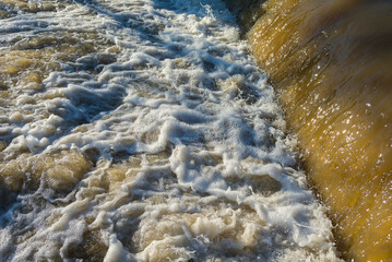 Rised water level in the creek after snow melted. Flood risk