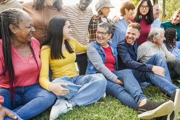Group of multigenerational people smiling and laughing together - Multiracial friends with...