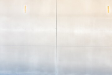 smooth polished concrete wall with light shadow play