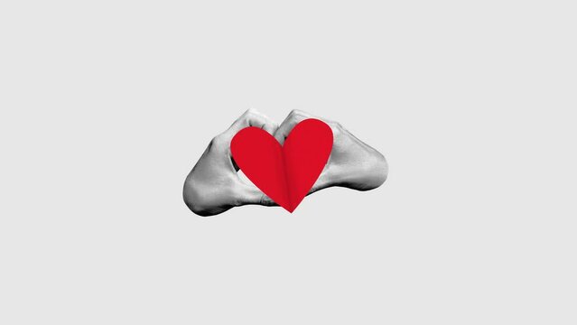 Male and female hands making heart symbol. Stop motion, animation. Minimalism. Concept of Valentine's Day, holiday, love, 14th of February. Template for ads, postcard, invitation, poster