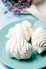 Delicious apple marshmallow. Handmade marshmallows made from applesauce. Blue background