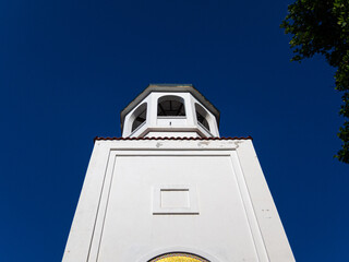 White bell tower of church