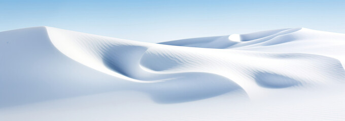 Snow Covered Hill With Blue Sky in Background