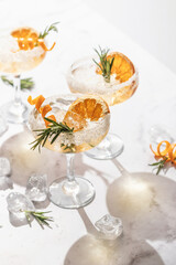 Sidecar cocktail with a sugar rim on white marble table. Festive party composition