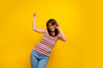 Photo of pretty nice girl with stylish hairdo wear striped tank touching glasses dancing hand up...