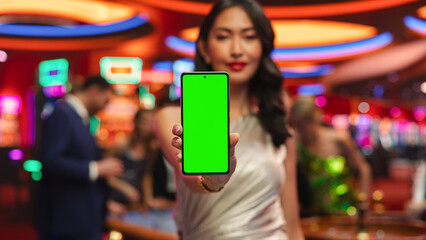 Advertising Template with an Asian Female Showing a Smartphone Device with a Green Screen Mock Up...