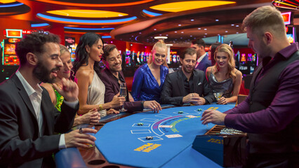 Portrait of People Cheering and Celebrating the Winner of a Blackjack Game in a Modern Casino....