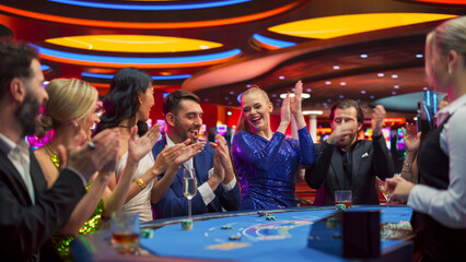 Portrait of People Cheering and Celebrating the Winner of a Blackjack Game in a Modern Casino....