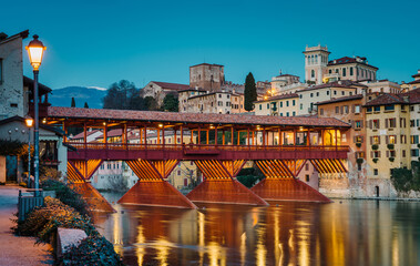 Bassano del Grappa, Italy - January 09, 2024: panorama of the Ponte degli Alpini in the evening - 706452972