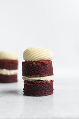 red velvet brownie with cream cheese frosting filling, red velvet brownies layered with cream cheese frosting on a white background