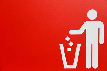 trash can sign or litter sign with read background. Person dropping litter in the trash.
